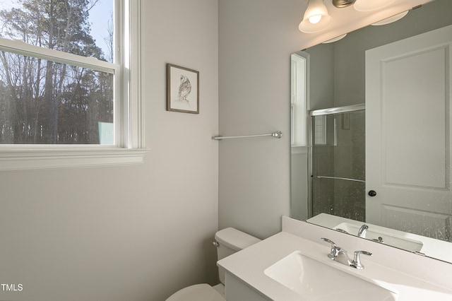 1475 Sierra Glen Cir, Apex, NC 27502 - full bathroom featuring toilet, plenty of natural light, a shower with door, and vanity