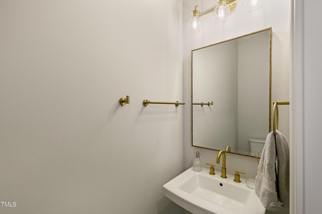 1475 Sierra Glen Cir, Apex, NC 27502 - half bathroom featuring a sink and toilet