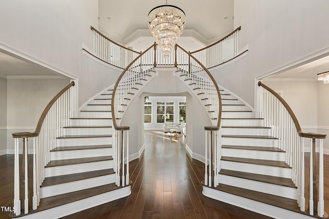 1475 Sierra Glen Cir, Apex, NC 27502 - staircase featuring a chandelier, a towering ceiling, wood-type flooring, and baseboards
