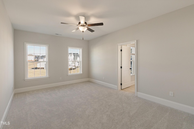 1475 Sierra Glen Cir, Apex, NC 27502 - empty room featuring light carpet, a ceiling fan, and baseboards
