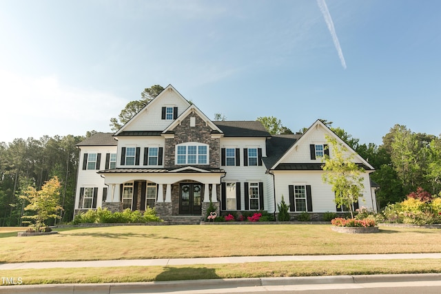 1475 Sierra Glen Cir, Apex, NC 27502 - craftsman house with stone siding, a front yard, a porch, and french doors