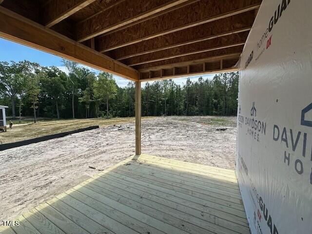 433 Old Fashioned Way, Lillington, NC 27546 - wooden terrace featuring view of wooded area