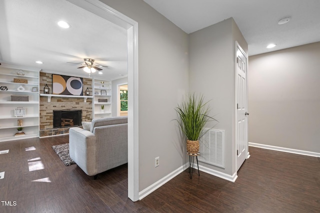 821 Stoneybrook Dr, Sanford, NC 27330 - living room featuring ceiling fan, wood finished floors, baseboards, a large fireplace, and recessed lighting