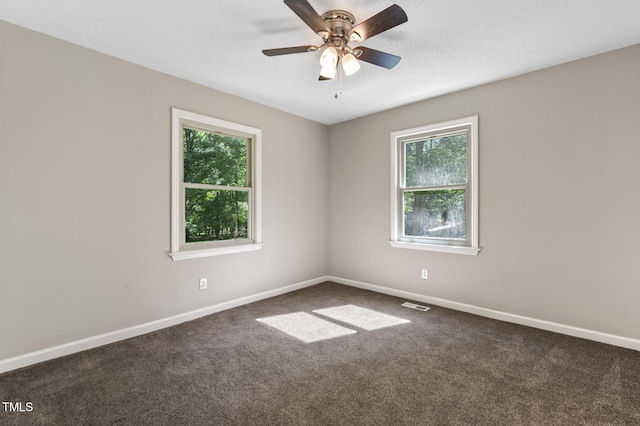 821 Stoneybrook Dr, Sanford, NC 27330 - empty room featuring plenty of natural light, baseboards, carpet floors, and ceiling fan