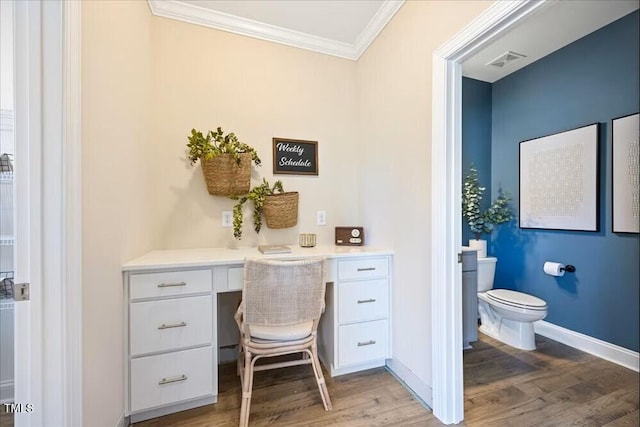 219 Broomgrove Way, Wake Forest, NC 27587 - home office with built in study area, crown molding, wood finished floors, and baseboards
