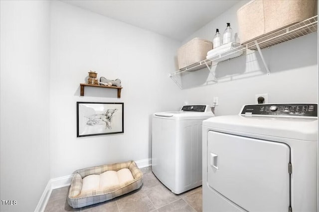 219 Broomgrove Way, Wake Forest, NC 27587 - laundry area with washing machine and dryer, light tile patterned flooring, and baseboards