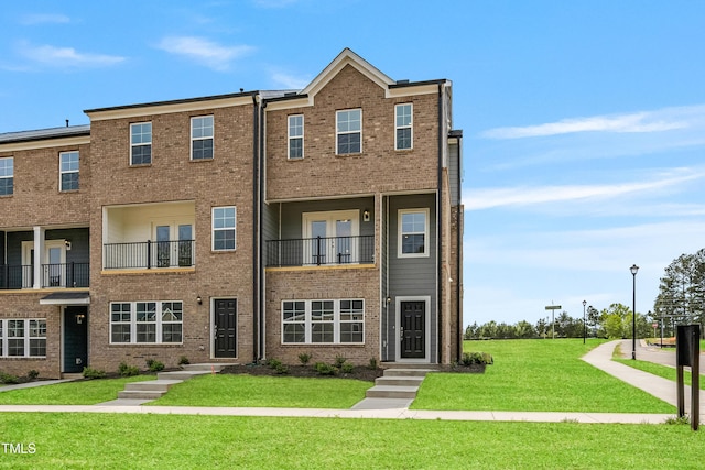 219 Broomgrove Way, Wake Forest, NC 27587 - view of property with a front lawn and brick siding