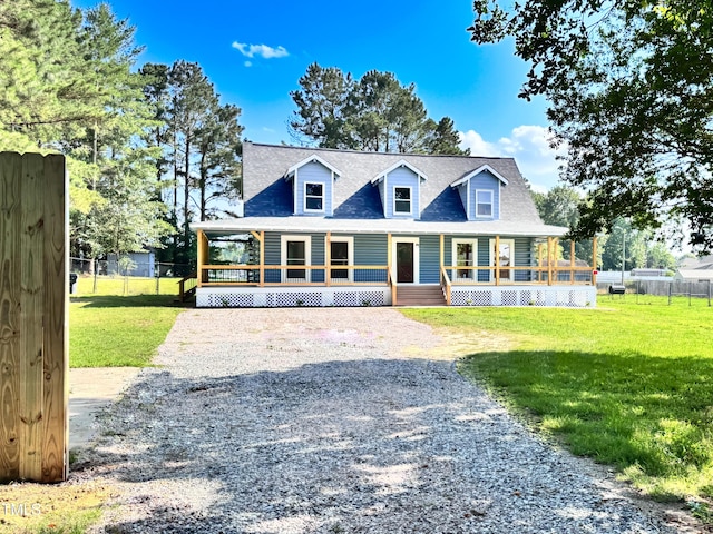 1283 Ennis Rd, Angier, NC 27501 - view of front facade featuring a porch, a shingled roof, and gravel driveway