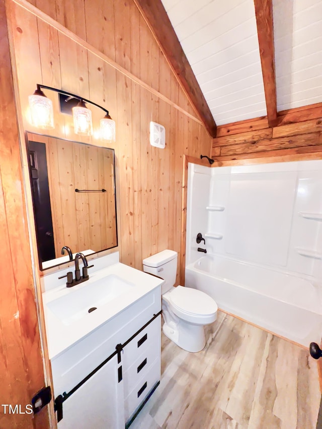 1283 Ennis Rd, Angier, NC 27501 - bathroom with vanity, wood walls, wood finished floors, toilet, and shower / bathtub combination