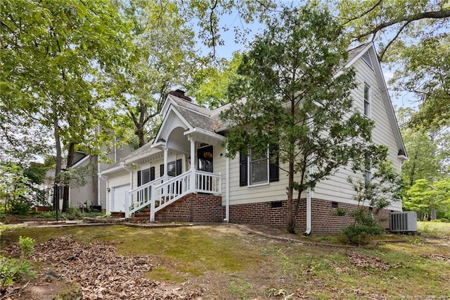 1266 Exeter Ln, Fayetteville, NC 28314 - view of front of house featuring a chimney, crawl space, and central air condition unit