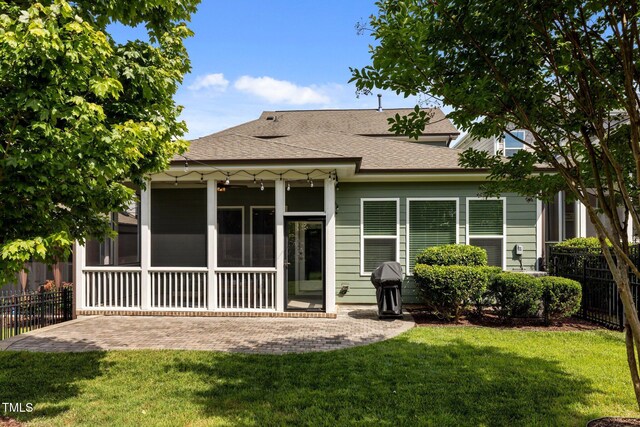 78 Salt Cedar Ln, Chapel Hill, NC 27516 - back of house with a patio, a shingled roof, and a sunroom