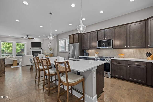 78 Salt Cedar Ln, Chapel Hill, NC 27516 - kitchen featuring appliances with stainless steel finishes, recessed lighting, dark brown cabinetry, open floor plan, and plenty of natural light