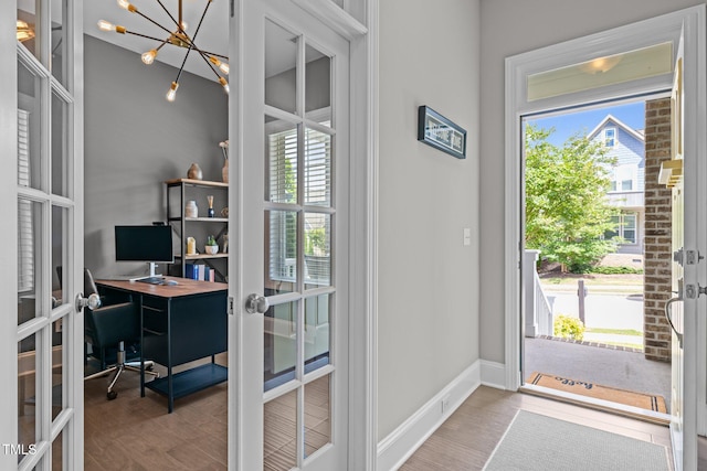 78 Salt Cedar Ln, Chapel Hill, NC 27516 - doorway to outside with french doors, a desk, wood finished floors, a chandelier, and baseboards