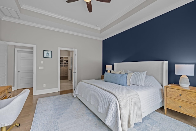 78 Salt Cedar Ln, Chapel Hill, NC 27516 - bedroom with a raised ceiling, wood finished floors, crown molding, baseboards, and ceiling fan