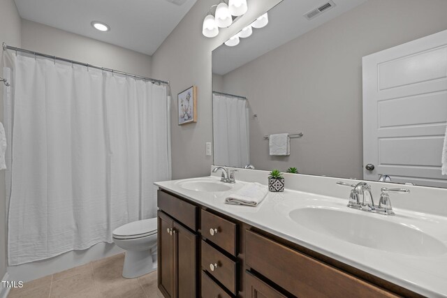 78 Salt Cedar Ln, Chapel Hill, NC 27516 - bathroom featuring toilet, double vanity, shower / bath combo, and tile patterned flooring