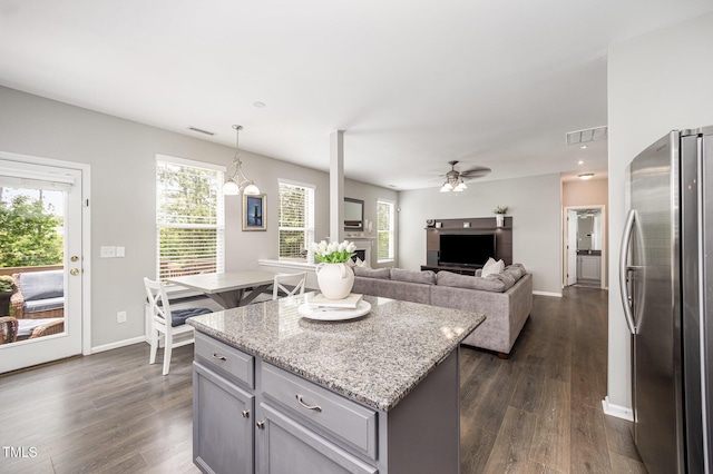 1211 Whispering Oak Ln, Durham, NC 27704 - kitchen with freestanding refrigerator, gray cabinets, a ceiling fan, and dark wood-style flooring