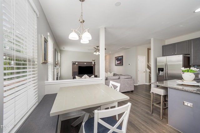 1211 Whispering Oak Ln, Durham, NC 27704 - dining space featuring ceiling fan, dark wood-style flooring, and a chandelier