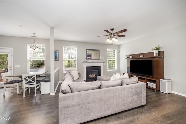 1211 Whispering Oak Ln, Durham, NC 27704 - living area featuring dark wood-type flooring, plenty of natural light, and baseboards