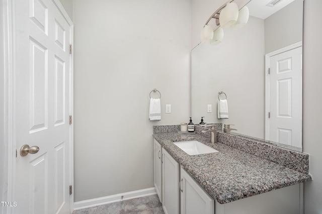 1211 Whispering Oak Ln, Durham, NC 27704 - bathroom with vanity and baseboards