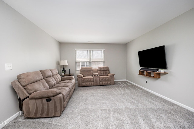1211 Whispering Oak Ln, Durham, NC 27704 - living room with carpet floors and baseboards