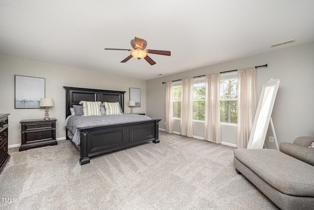 1211 Whispering Oak Ln, Durham, NC 27704 - bedroom featuring baseboards, light carpet, and a ceiling fan