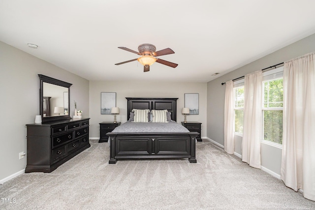 1211 Whispering Oak Ln, Durham, NC 27704 - bedroom featuring baseboards, light carpet, and ceiling fan