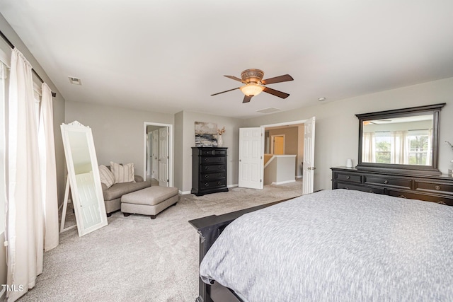 1211 Whispering Oak Ln, Durham, NC 27704 - bedroom featuring light carpet, baseboards, and ceiling fan