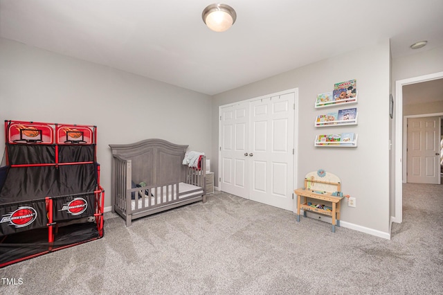 1211 Whispering Oak Ln, Durham, NC 27704 - bedroom with carpet flooring, baseboards, and a closet