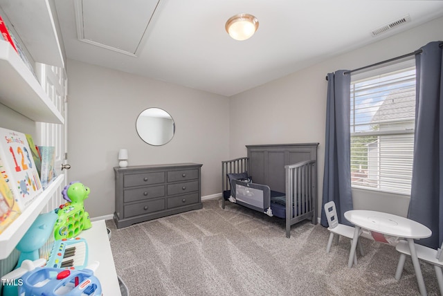 1211 Whispering Oak Ln, Durham, NC 27704 - carpeted bedroom featuring baseboards and a crib