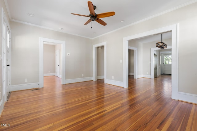 409 N Hyde Park Ave, Durham, NC 27703 - unfurnished living room with wood finished floors, a ceiling fan, baseboards, and crown molding