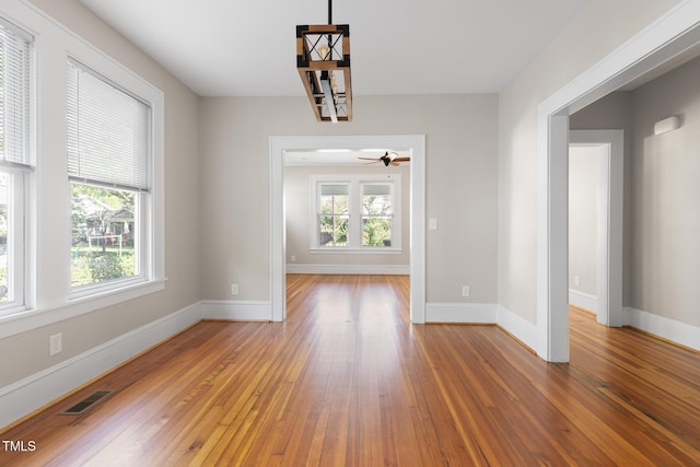 409 N Hyde Park Ave, Durham, NC 27703 - unfurnished dining area with healthy amount of natural light, hardwood / wood-style flooring, and baseboards