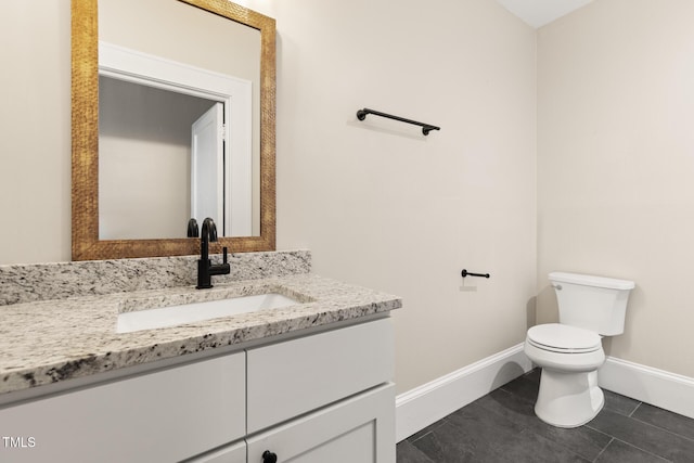409 N Hyde Park Ave, Durham, NC 27703 - bathroom featuring vanity, baseboards, and toilet