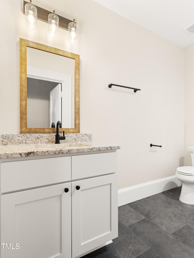 409 N Hyde Park Ave, Durham, NC 27703 - half bathroom with vanity, toilet, and baseboards