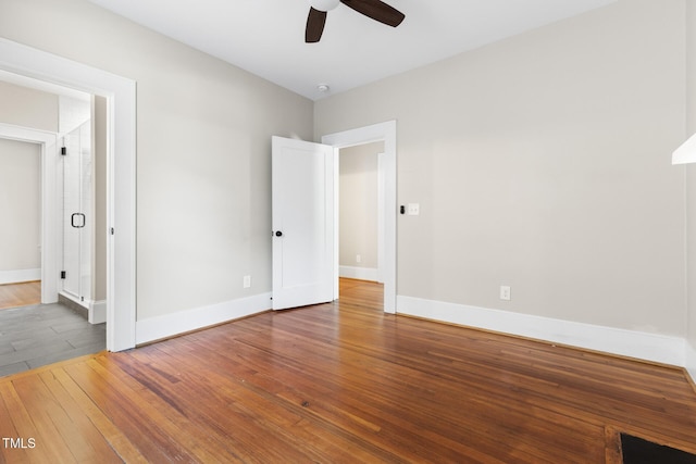 409 N Hyde Park Ave, Durham, NC 27703 - unfurnished bedroom with hardwood / wood-style flooring, baseboards, and a ceiling fan