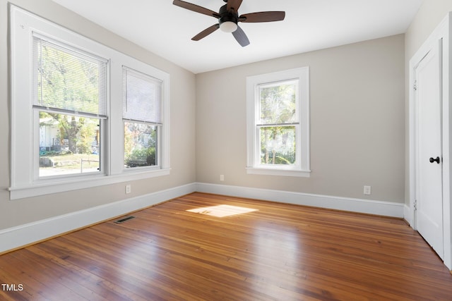 409 N Hyde Park Ave, Durham, NC 27703 - spare room with baseboards, hardwood / wood-style floors, and a ceiling fan