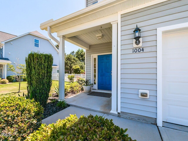 1004 Bridlemine Dr, Fuquay Varina, NC 27526 - property entrance with covered porch and a garage