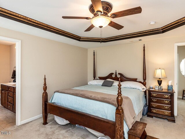 1004 Bridlemine Dr, Fuquay Varina, NC 27526 - bedroom with light colored carpet, ensuite bathroom, ceiling fan, and baseboards