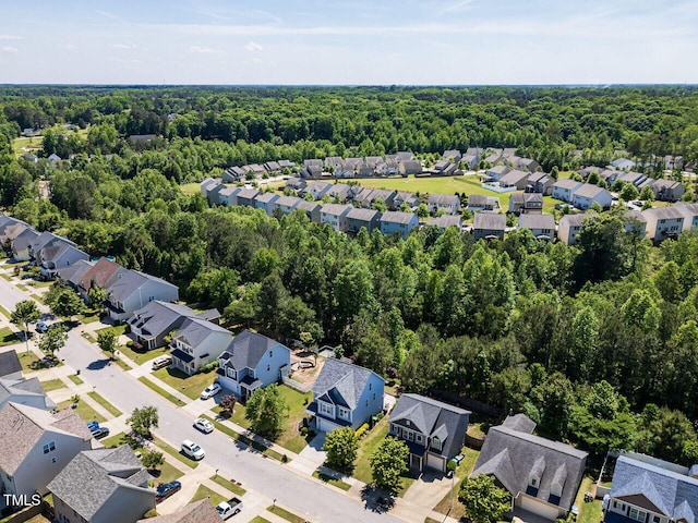 1004 Bridlemine Dr, Fuquay Varina, NC 27526 - aerial perspective of suburban area with a heavily wooded area
