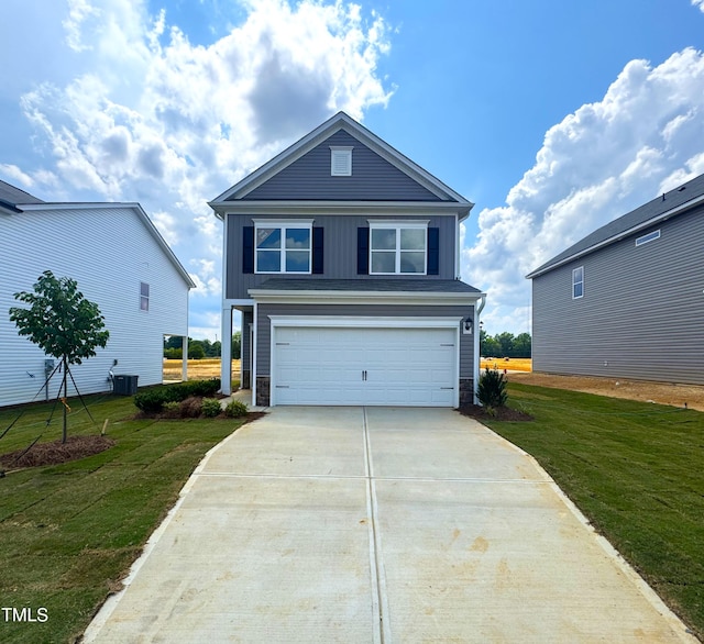 136 Bruce Dr, Dunn, NC 28334 - traditional-style home with board and batten siding, concrete driveway, a garage, a front yard, and stone siding