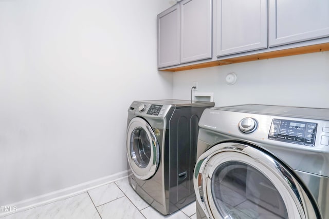 1021 Benay Rd, Morrisville, NC 27560 - laundry area featuring cabinet space, washer and dryer, and baseboards