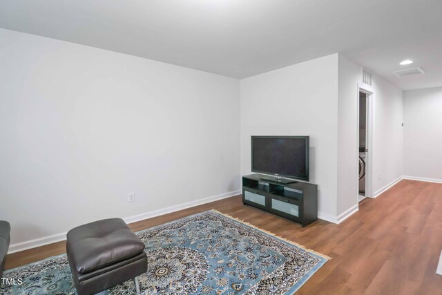 1021 Benay Rd, Morrisville, NC 27560 - living area with baseboards, wood finished floors, and recessed lighting
