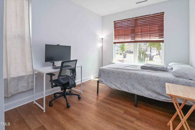 1021 Benay Rd, Morrisville, NC 27560 - bedroom featuring wood finished floors, baseboards, and a desk