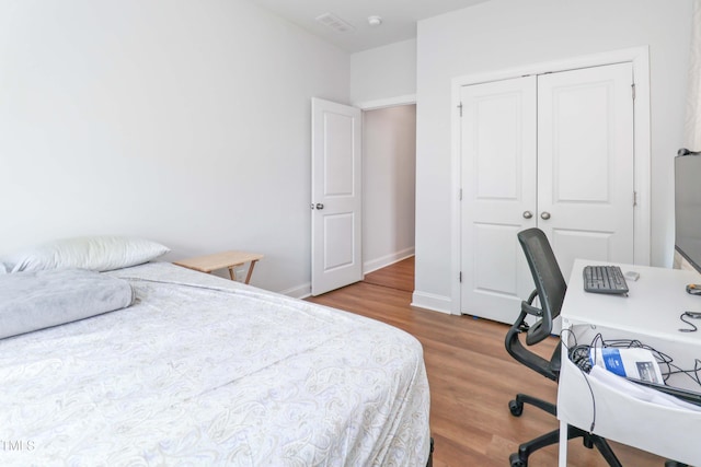 1021 Benay Rd, Morrisville, NC 27560 - bedroom featuring wood finished floors and a closet
