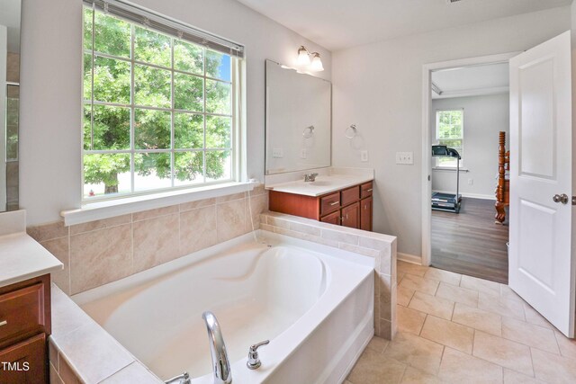 1021 Benay Rd, Morrisville, NC 27560 - full bath featuring vanity, healthy amount of natural light, and a garden tub