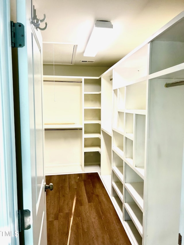 1021 Benay Rd, Morrisville, NC 27560 - spacious closet with attic access and dark wood-type flooring