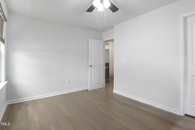 1021 Benay Rd, Morrisville, NC 27560 - spare room with dark wood-style floors, a ceiling fan, and baseboards
