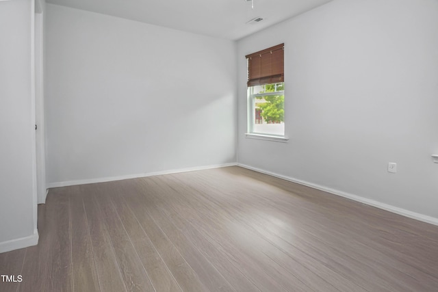 1021 Benay Rd, Morrisville, NC 27560 - empty room with wood finished floors, baseboards, and ceiling fan