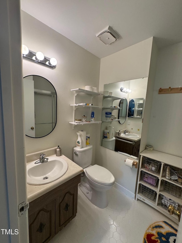 1708 Quail Ridge Rd, Raleigh, NC 27609 - bathroom featuring tile patterned flooring, toilet, and vanity