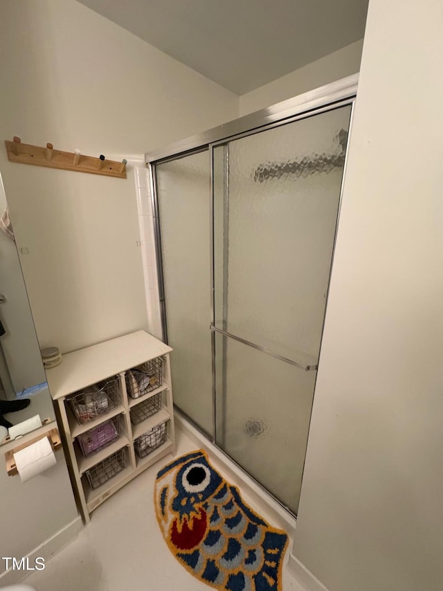 1708 Quail Ridge Rd, Raleigh, NC 27609 - bathroom with a shower with door and baseboards