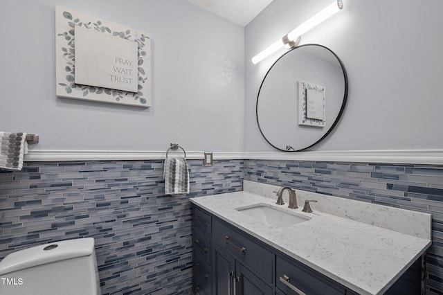 1785 Mitchells Chapel Rd, Pittsboro, NC 27312 - bathroom featuring tile walls, vanity, toilet, and wainscoting